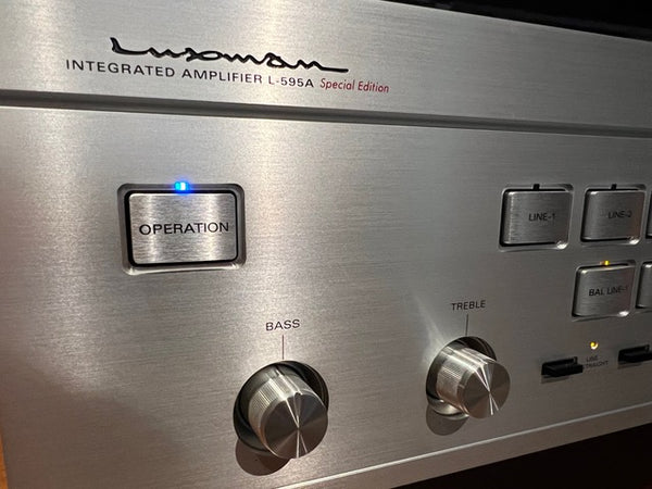 Luxman L-595A front panel logo and power button closeup