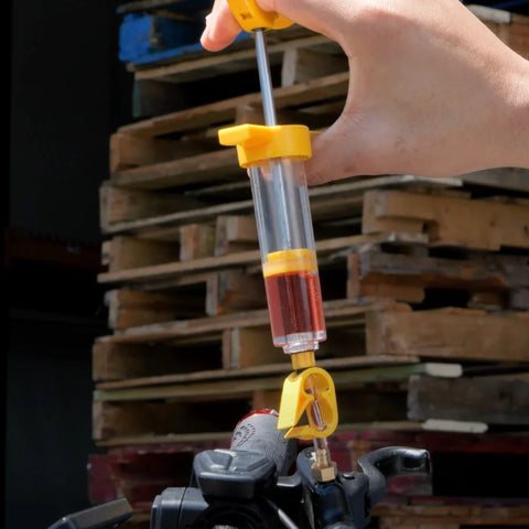 Press the syringe to remove any air bubbles in the brake fluid