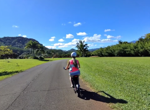 Jackie Poteet real VoroMotors customer riding her EMOVE RoadRunner electric scooter through Oahu, HI