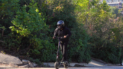 Minimotors Dualtron Thunder 2 electric scooter with man riding uphill