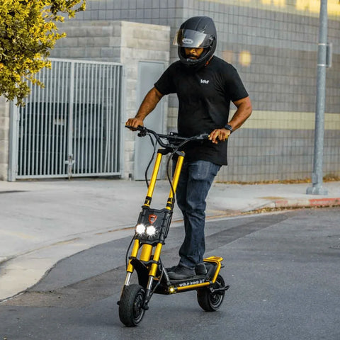 Kaabo Wolf King GT electric scooter with man in helmet riding