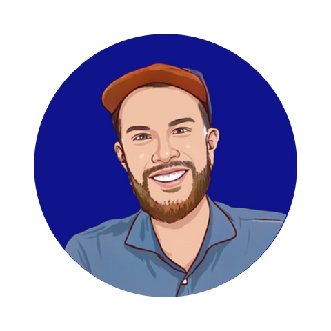 A cartoon drawing  of Kai wearing a blue button down shirt and red hat. He has a beard and is smiling.