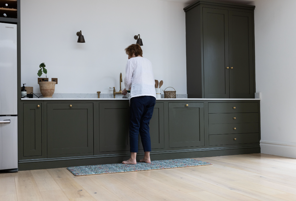 lady washing up standing on ergo foam kitchen runner