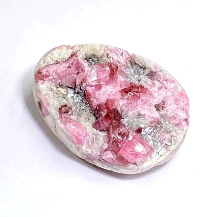 raw pink tourmaline crystals in their host stone