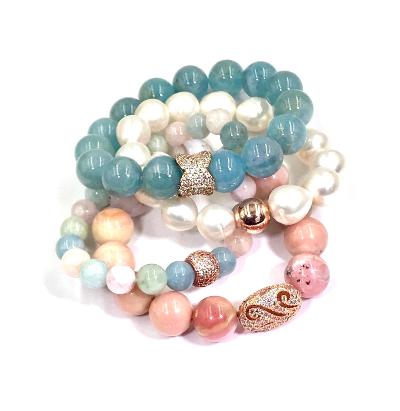 Blue aquamarine bracelets show in a stacking combination