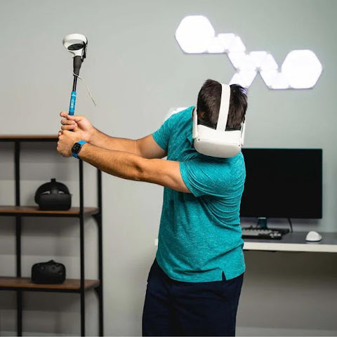 Young man playing virtual reality golf with a virtual reality headset using the Glistco G-Iron product