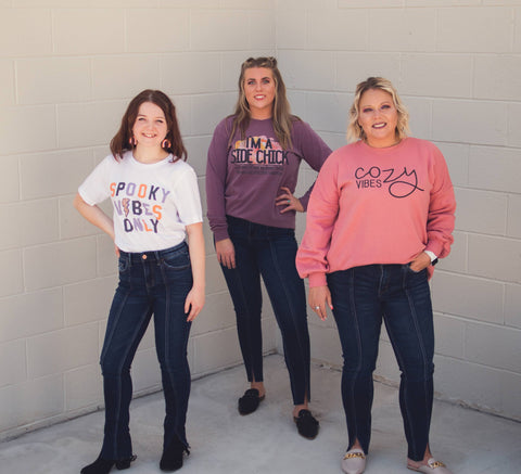 3 Ladies in graphic tees and sweatshirts