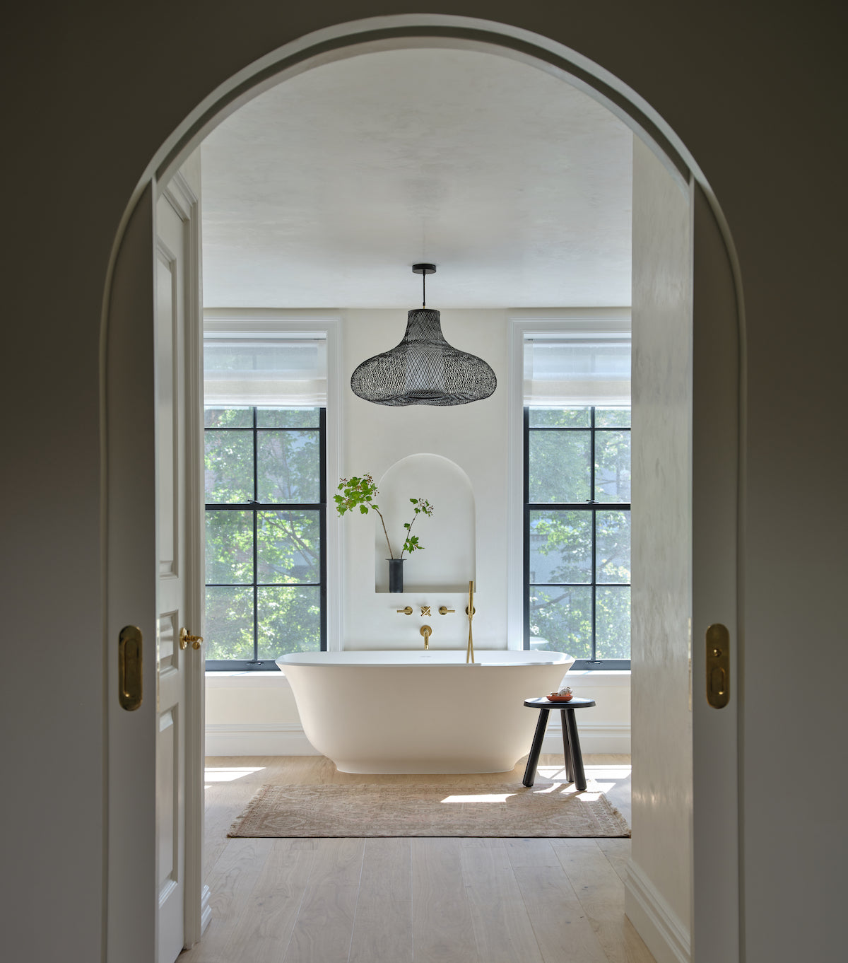 A modern bathroom with white oak hardwood flooring