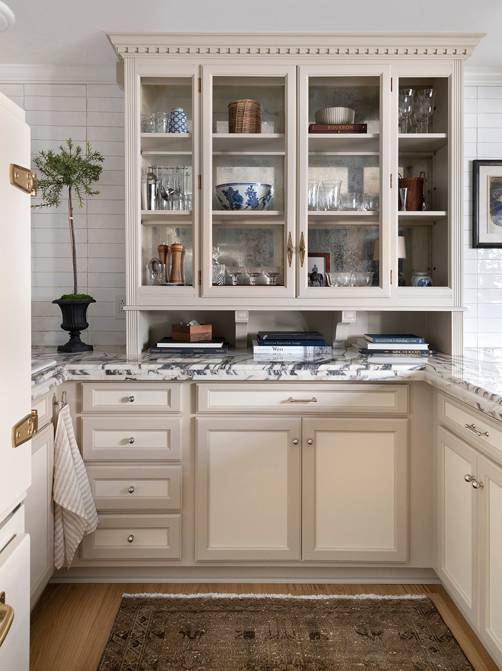 Sarah Gibson's basement kitchen with marble counters and hardwood floors