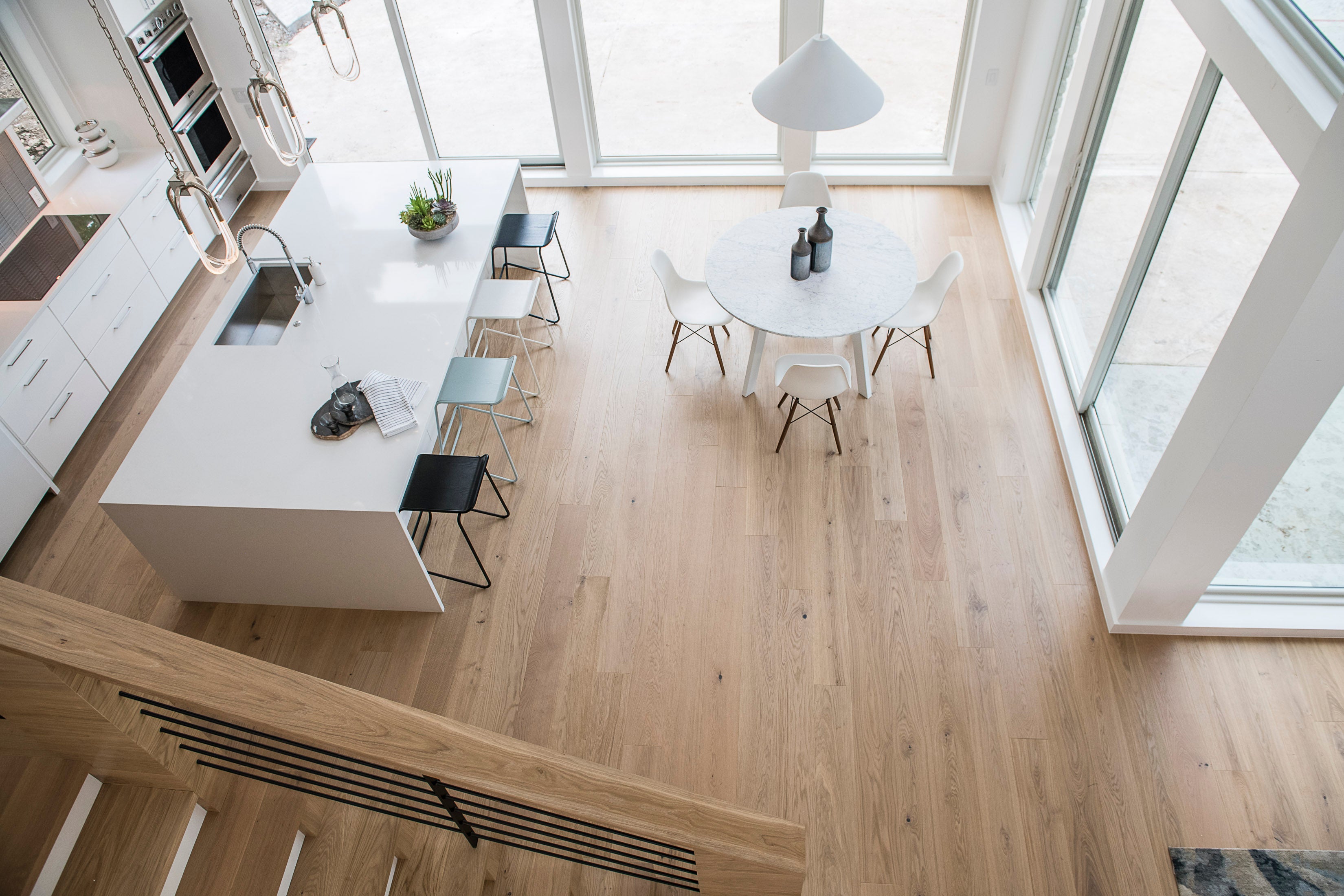 Overhead shot of Fika flooring by Stuga in a kitchen showing variation between boards