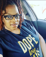 black woman wearing dope by default tshirt