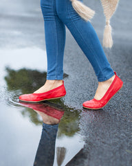 women wearing red foldable ballet flats