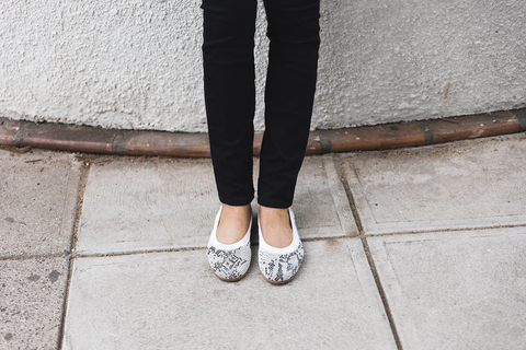 women wearing printed ballet flats