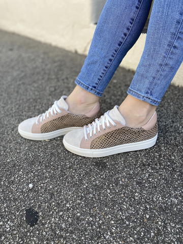 women wearing printed sneakers