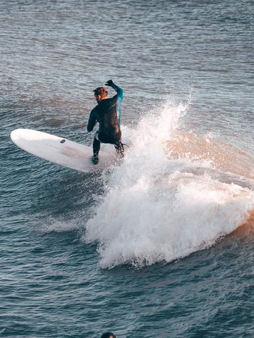 Esteban surfing
