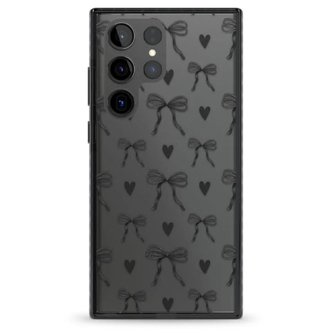 Clear phone case with black bows and hearts design by Blanc Space, providing a bold and stylish option for phone protection.