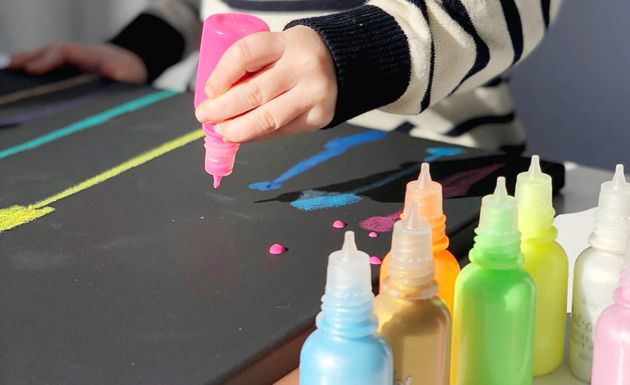 embellishing a dazzling fireworks scene with Dot-a-lot pearlescent paint.