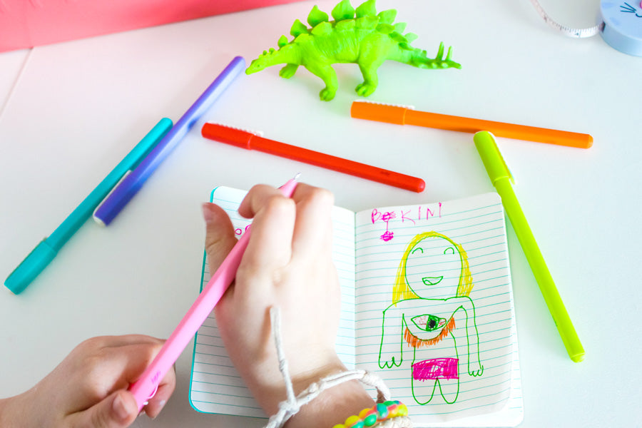 Write and doodle on the lined paper of Pocket Pals journals with Modern Writers Gel Pens