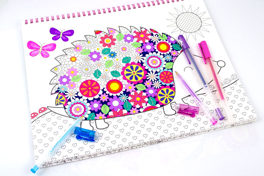 Colored gel pens and Yummy Glitter Gel Pens in hedgehog coloring book