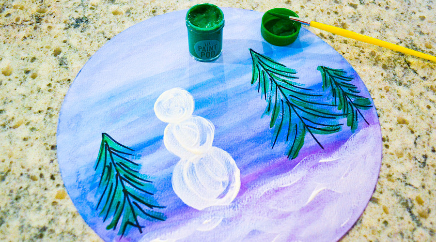 snowman and trees painted on blue and purple background