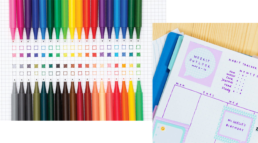 rainbow assortment of markers next to planner page