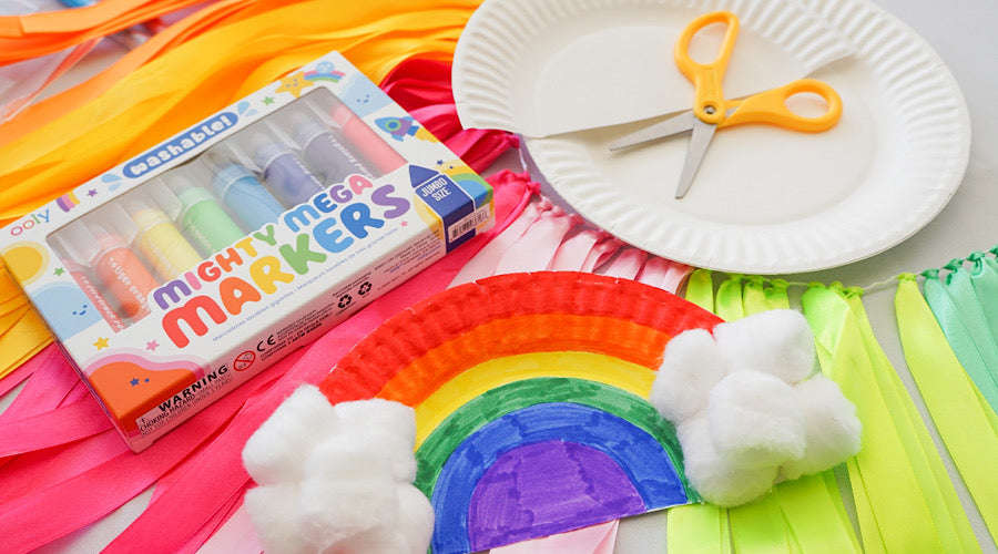 Rainbow craft and rainbow markers on rainbow banner