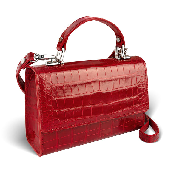 side view of sustainably-sourced, red crossbody handbag in luxurious alligator leather