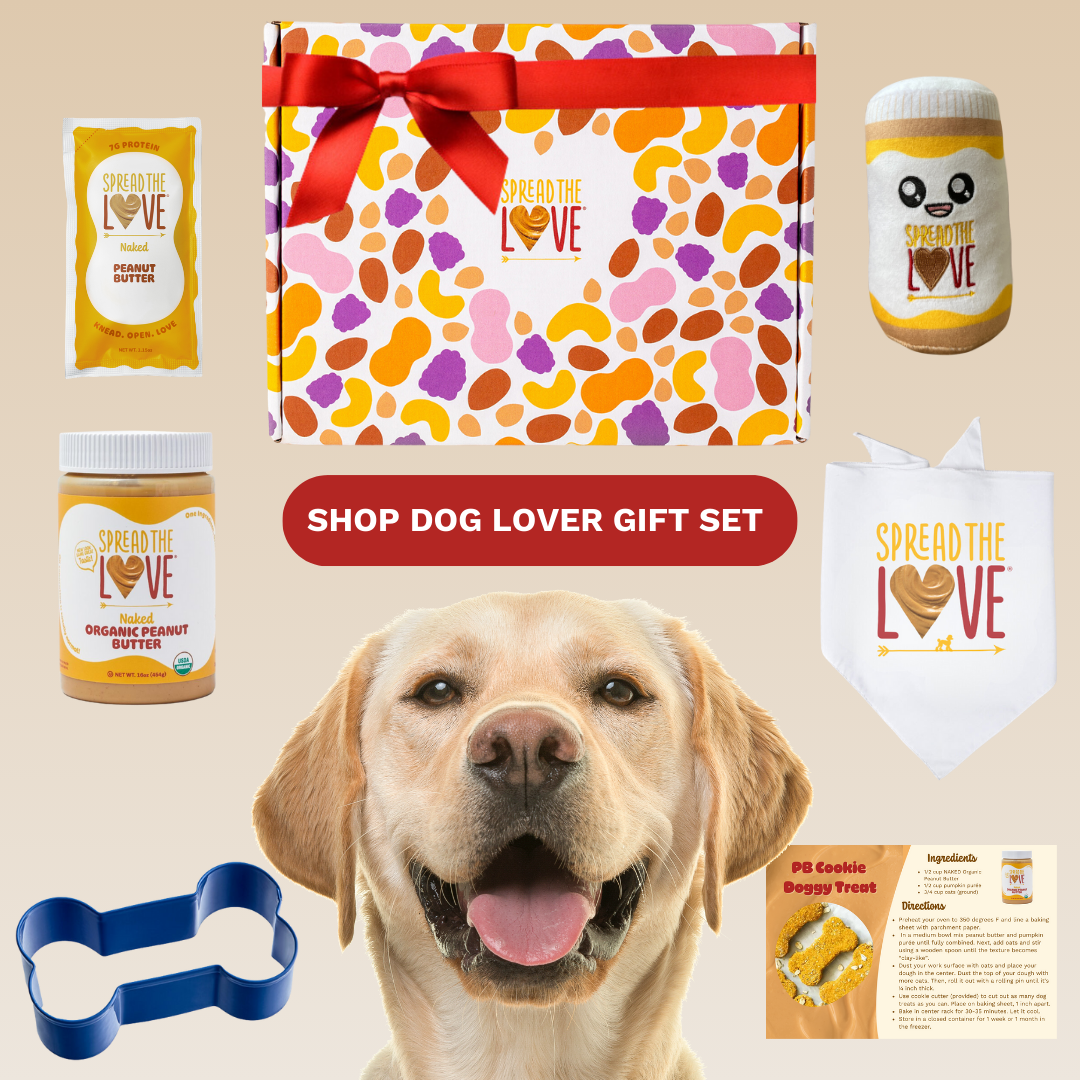 Dog with the Dog Lover Gift Set which includes PBlushie, Peanut Butter Jar & Packet, Bone cookie cutter, Dog bandana, and recipe card
