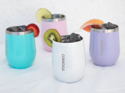 Four multiple color
corkcicle tumblers with drinks inside