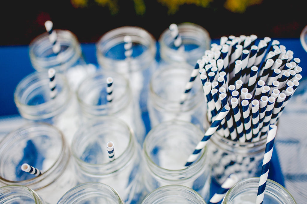 Glass jars filled with straws