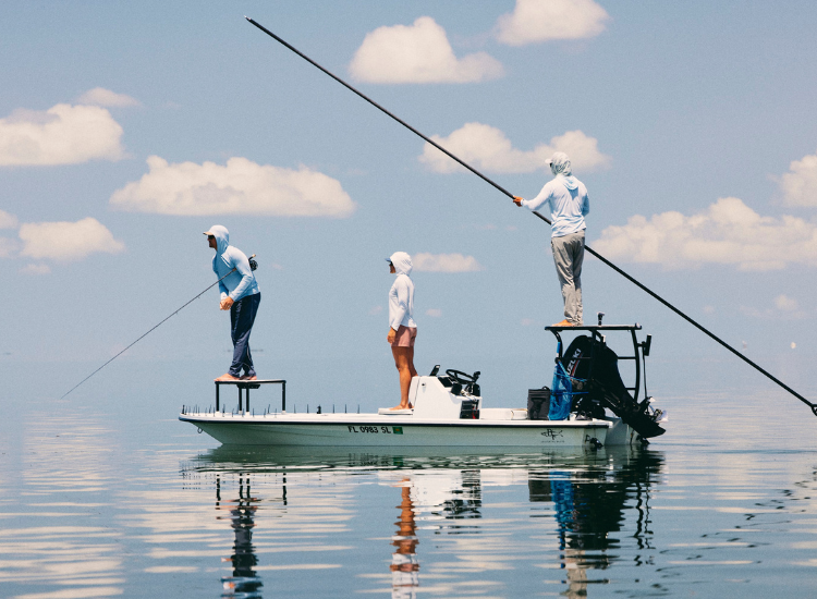 Group fishing on a boat in hot weather