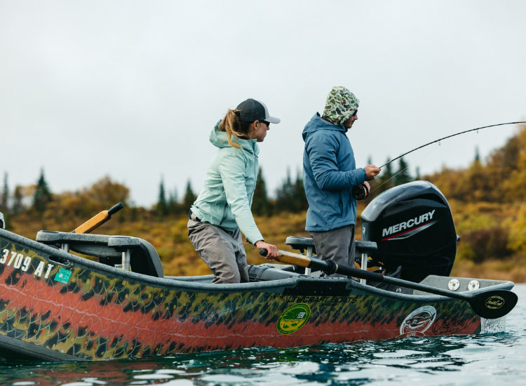 Man and woman fishing in rainy weather