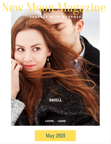 Couple, man smelling smiling woman's hair Precious Hammer Jewelry Magazine 