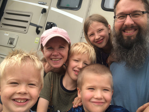 photo of Red's Gone Green family in front of their Class C motorhome
