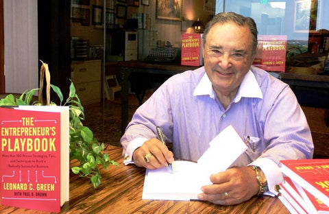 man signing books