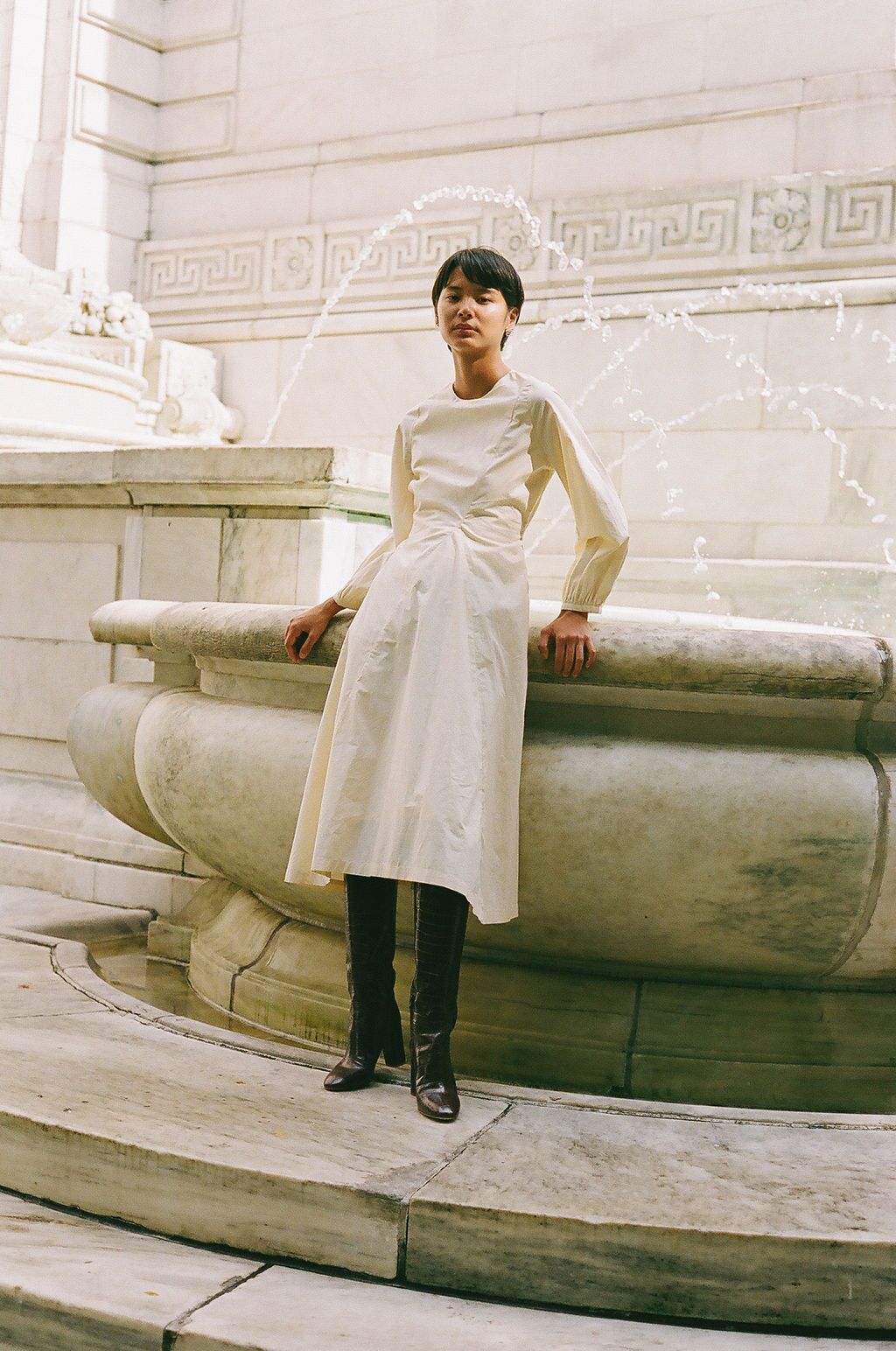 A transitional ivory cotton midi dress with balloon sleeves.