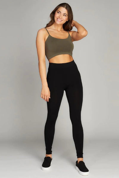 A woman wears a pair of high waisted leggings