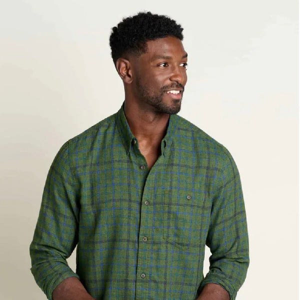 A man is shown wearing a Toad & Co shirt, which is  made from 100 percent recycled materials.