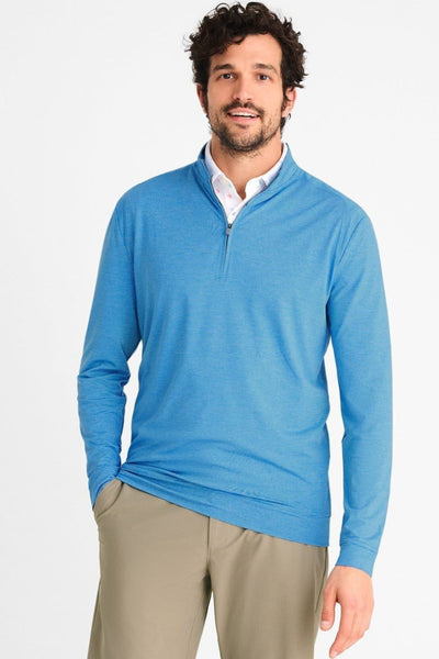 A man is shown in a 1/4 zip pullover top in a sky blue colour.