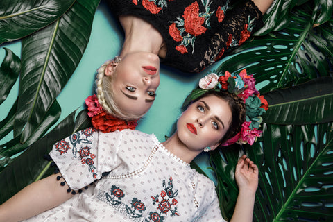 Models wear monstera stud earrings for the Katmeleon Jewellery Frida Kahlo Collection