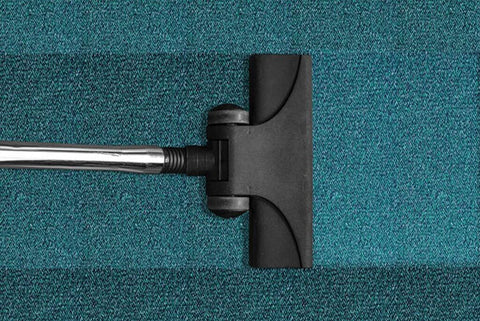 vacuuming carpet