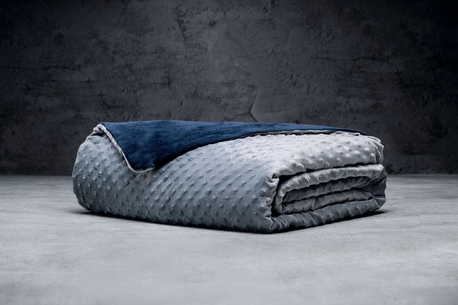A folded Luxome Removable Cover Weighted Blanket in navy and grey color.