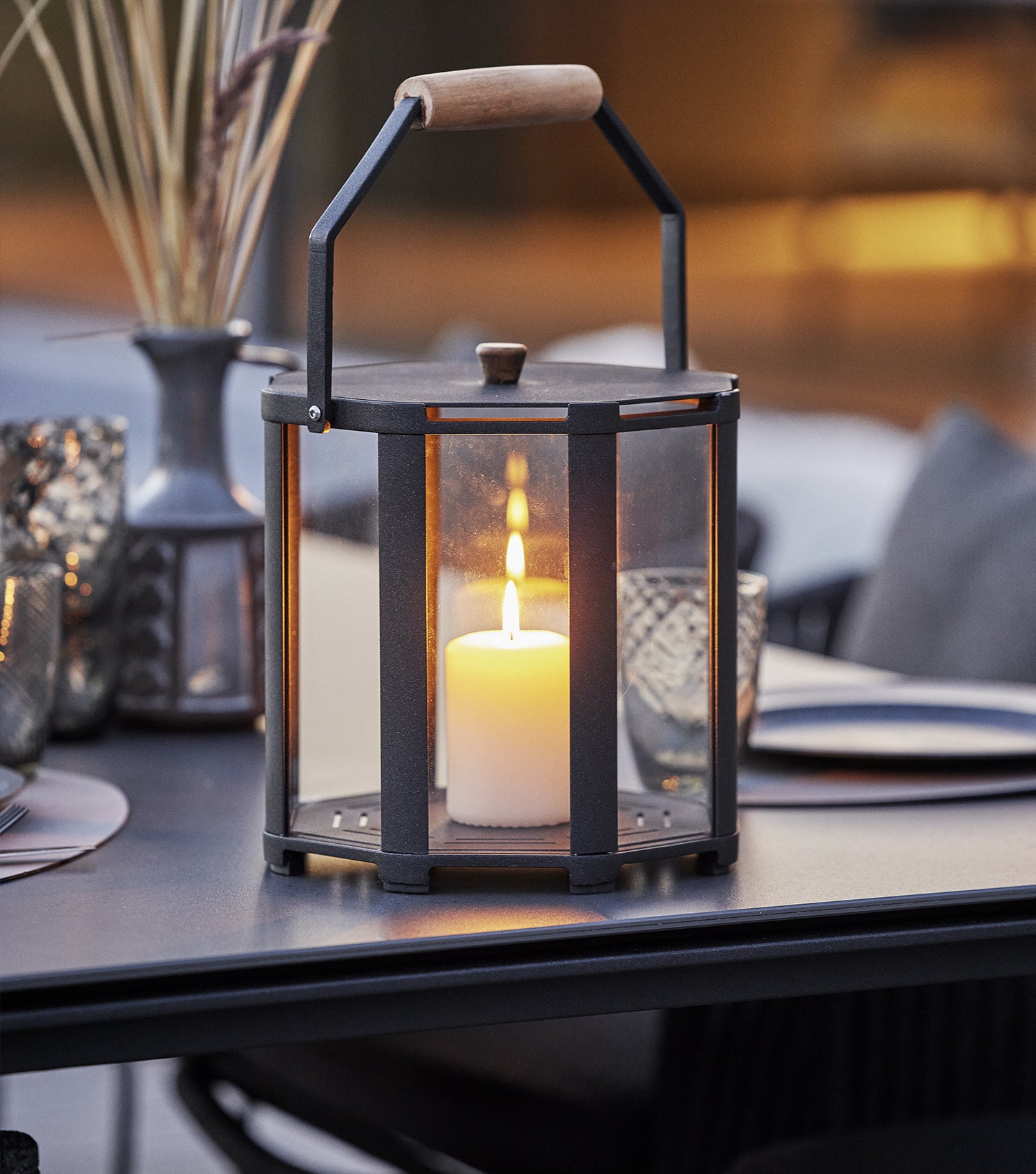 Lava-grey Lightlux lantern on diningtable