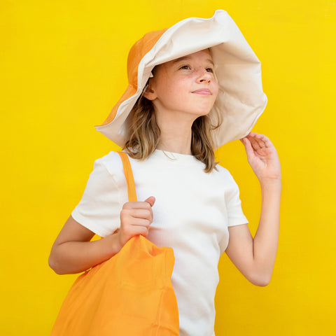 Wear a hat to keep cool and avoid excessive sweating, as sweat irritates the skin and can help lead to eczema flare-ups.