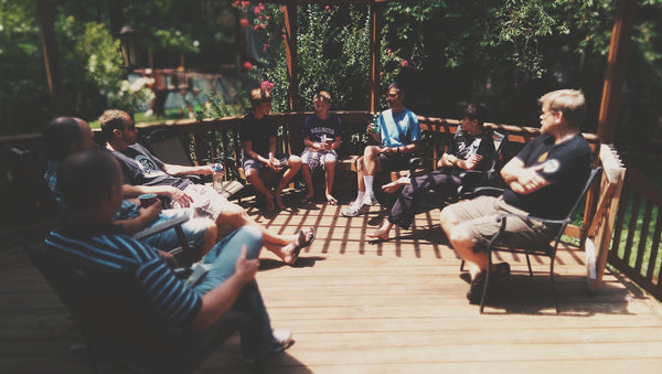 men gathered around for a rite of passage ceremony