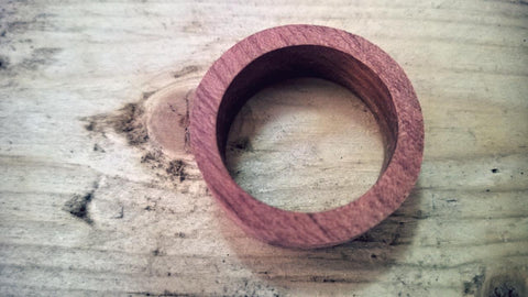 Once the ring has been sanded down fairly round, do the rest by hand or back to the belt sander. Finish by beveling the inside and outside edges.