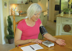 Woman using a BIOS Diagnostic Blood Pressure Machine