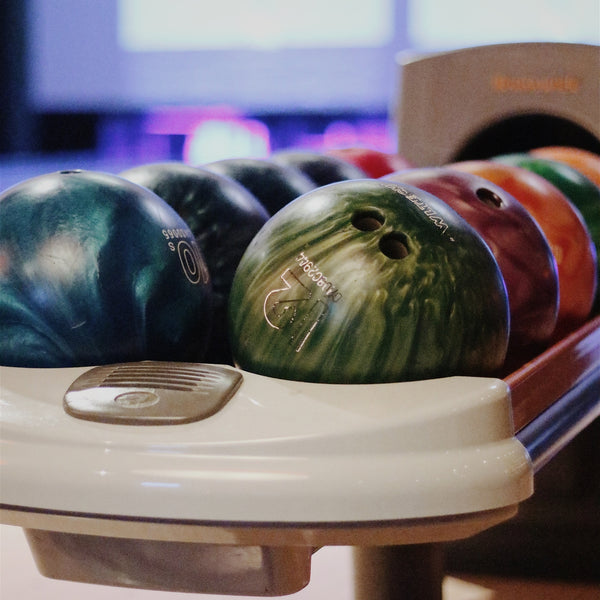 bowling bowls on rack