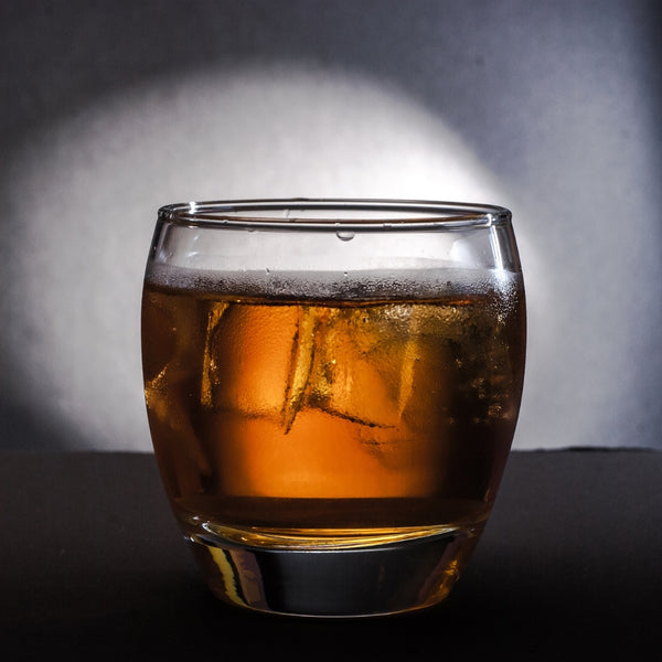 whiskey glass with ice cubes