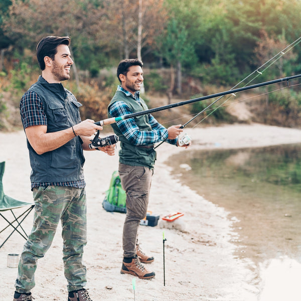 two men fishing off the shore